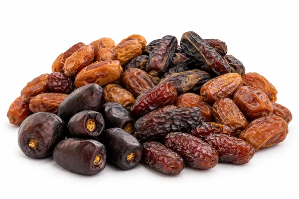 Several Iranian date cultivars heaped together, from pale amber to near-black