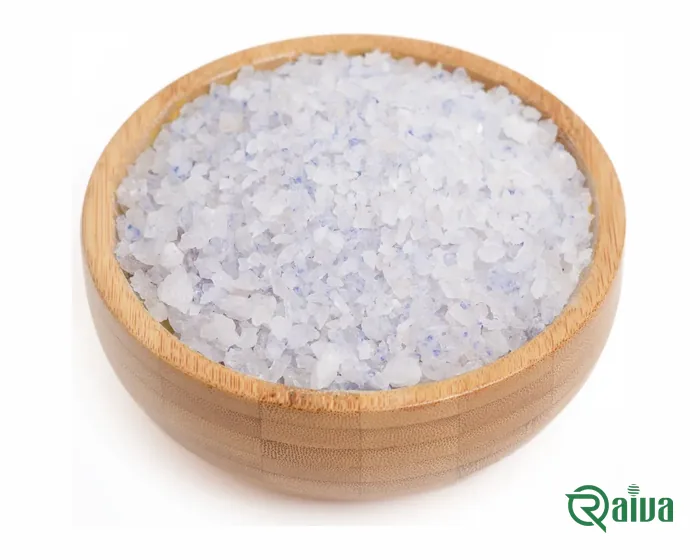 Rare blue-hued rock salt crystals in a wooden bowl