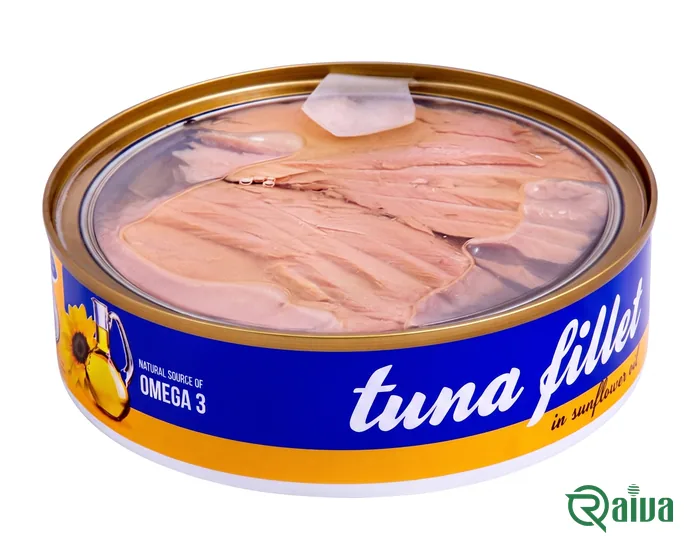 A round can of tuna fillet in sunflower oil under a clear peel-off lid