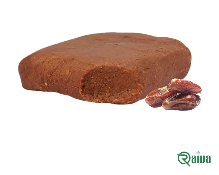 A pressed block of smooth brown date paste beside two whole dates