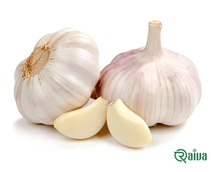 Whole garlic bulbs beside separated cloves