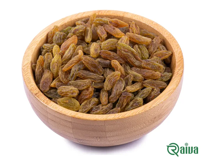Long green-brown seedless raisins in a wooden bowl