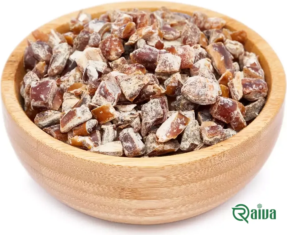 Diced date pieces cut to a uniform size, in a wooden bowl