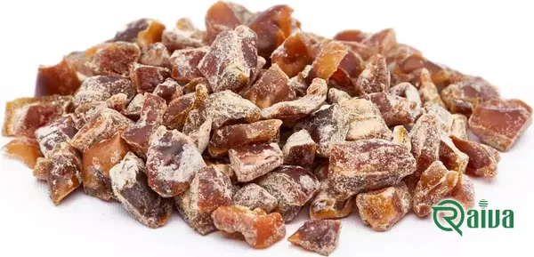 Diced date pieces cut to a uniform size, in a wooden bowl (view 2)