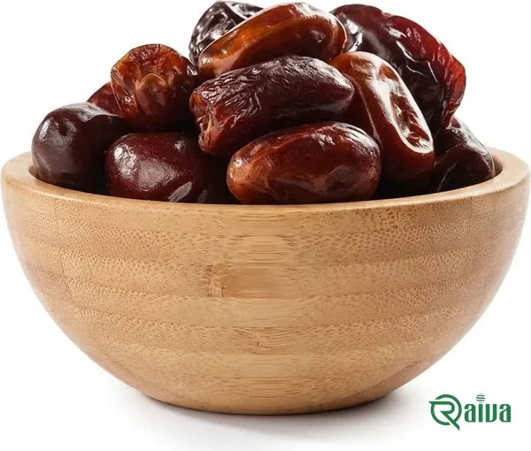 Soft amber-brown Kabkab dates in a wooden bowl (view 1)