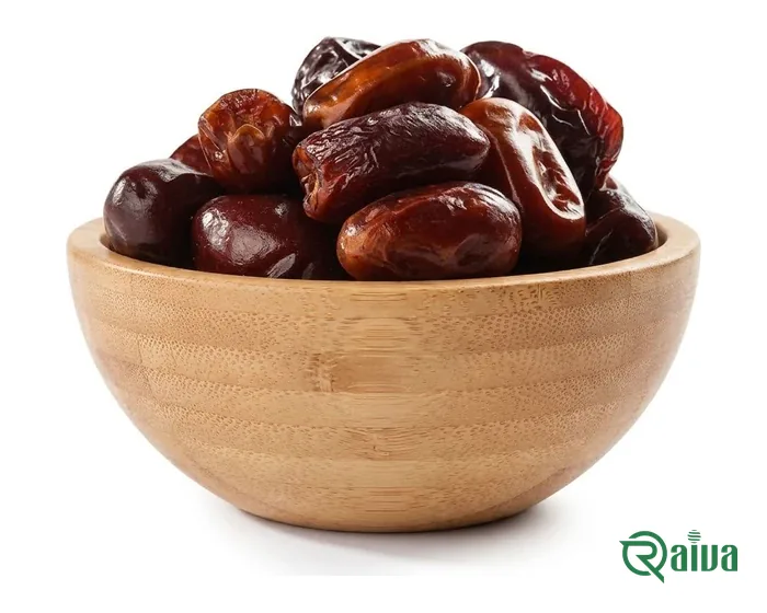 Soft amber-brown Kabkab dates in a wooden bowl