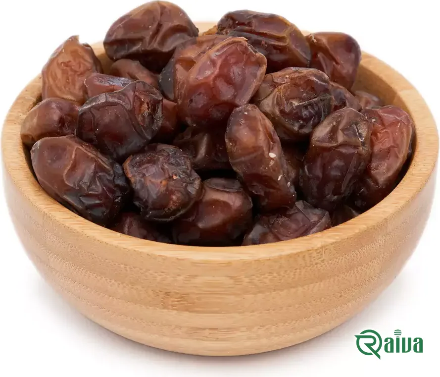 Reddish-brown semi-dry Khasouei dates in a wooden bowl
