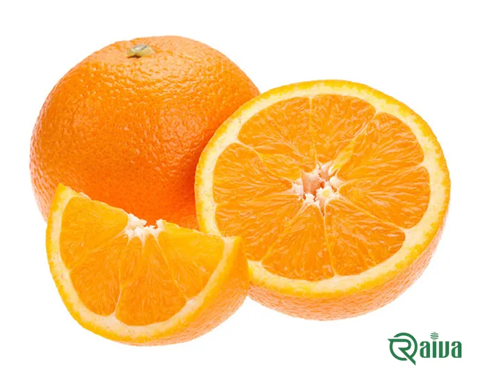 A whole orange beside cut halves