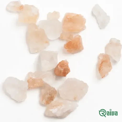 Coarse pink rock salt crystals in a dark wooden bowl (view 3)