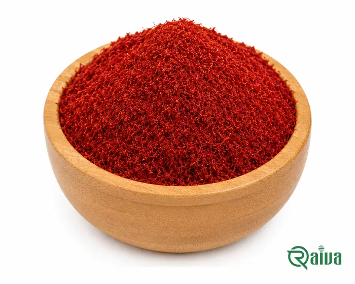 Fine red saffron powder in a wooden bowl