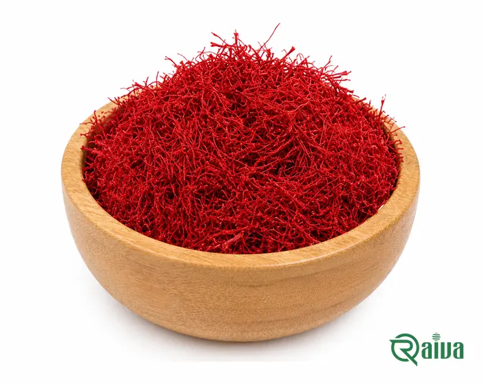All-red Sargol saffron threads heaped in a wooden bowl
