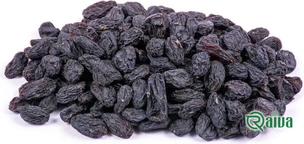 Dark Shahani raisins in a wooden bowl (view 1)