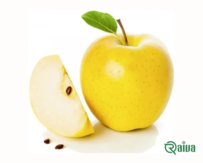Golden-skinned yellow apples, one cut in half