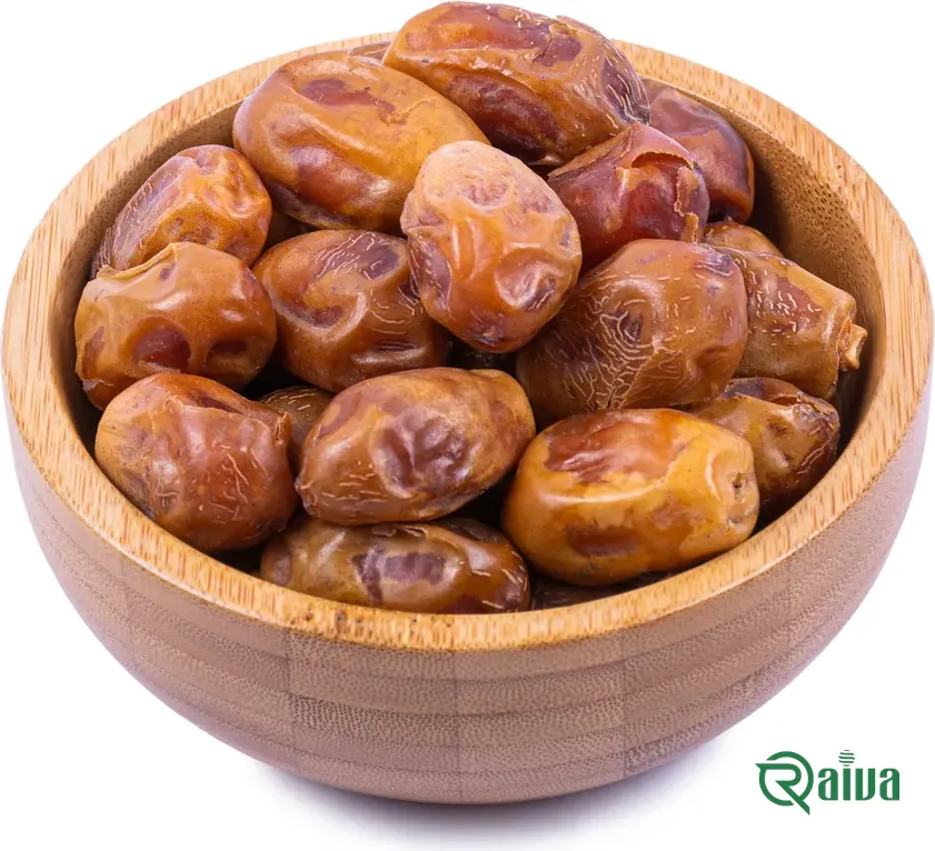Firm golden-brown Zahedi dates in a wooden bowl